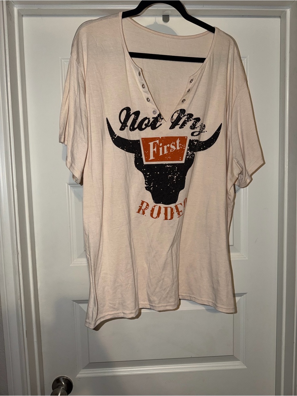 Amazon Women's Light Pink V-Neck Graphic Tee with Black and Orange Print